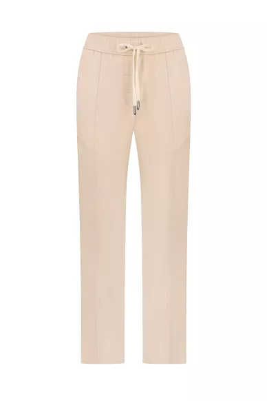 Вискозные молочные зауженные брюки на резинке в стиле спортшик Джерси - фото