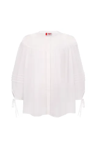 Snow-white linen blouse in the ethnic style of Iga